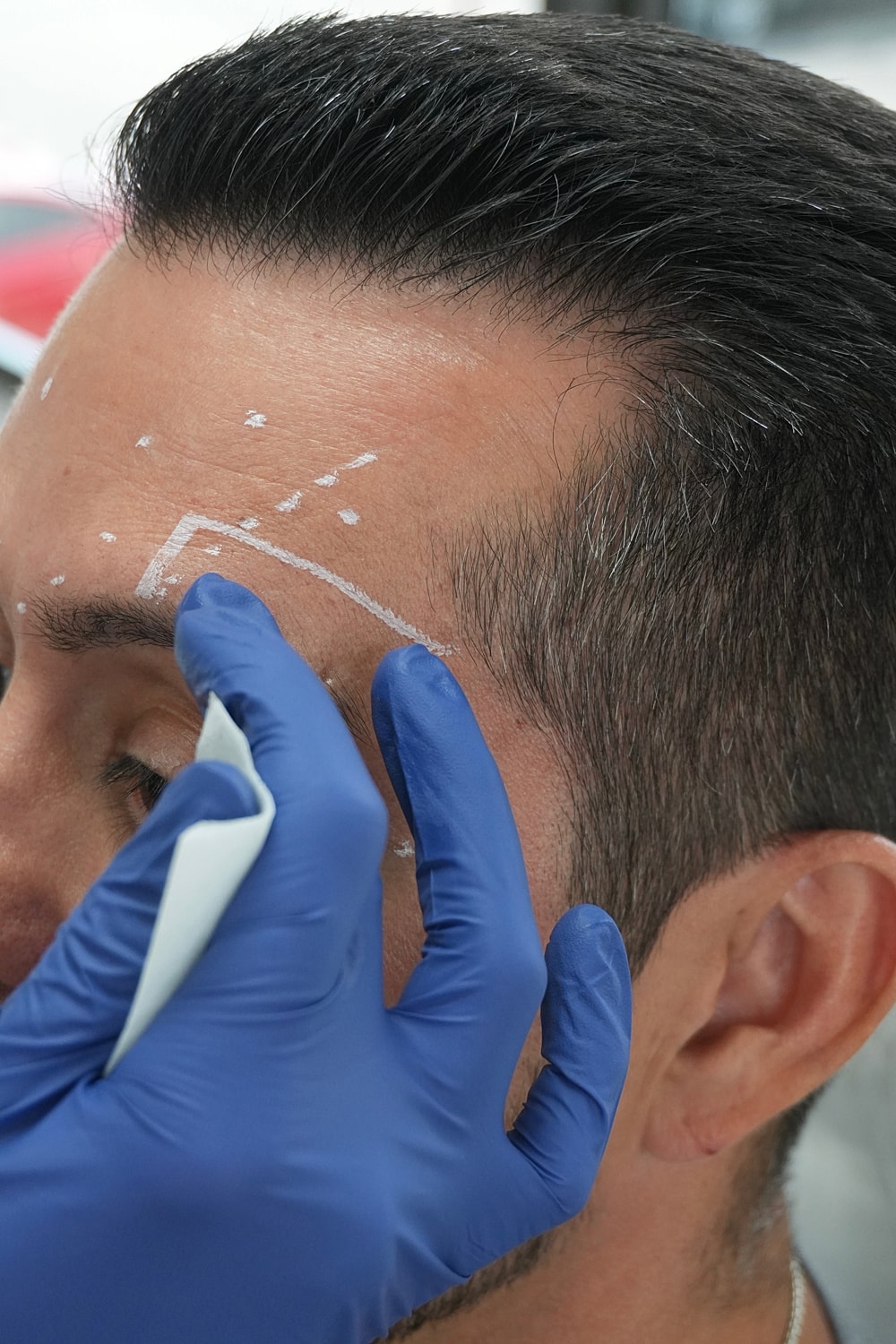 Consultation for eyebrow microblading procedure.