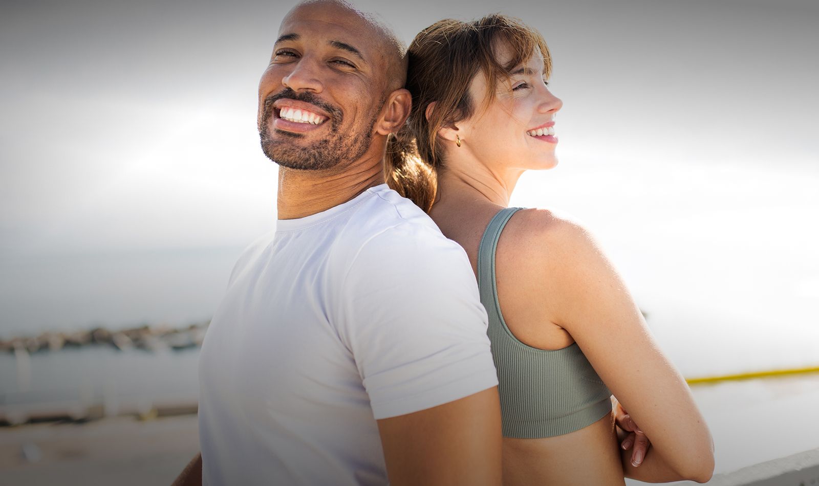 Smiling couple enjoying outdoor fitness together.