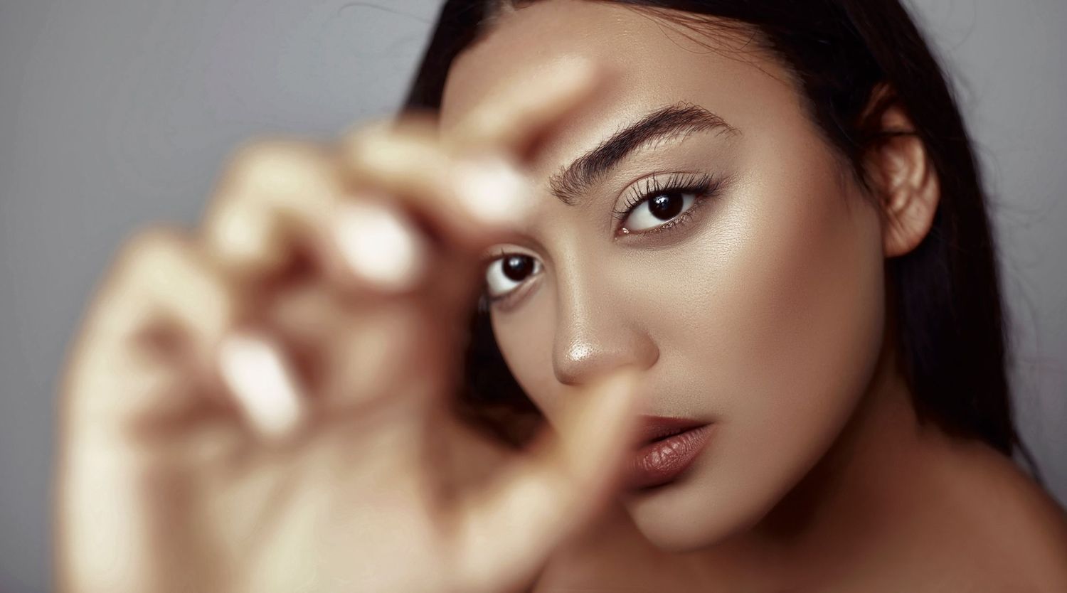 Professional portrait of a woman with long hair.